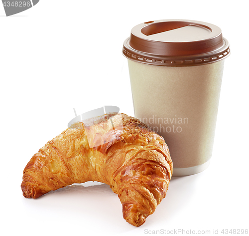 Image of freshly baked croissant and coffee