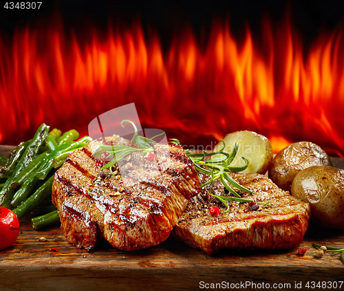 Image of freshly grilled steaks and vegetables