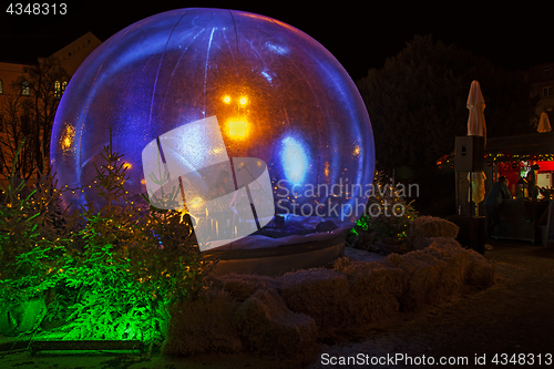 Image of Christmas snow globe in which the flute player as part of Advent