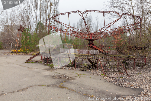 Image of Attraction in amusement park in overgrown ghost city Pripyat.