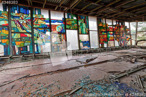 Image of Stained glass inside of abandoned and ruined building of river port in overgrown ghost city Pripyat.