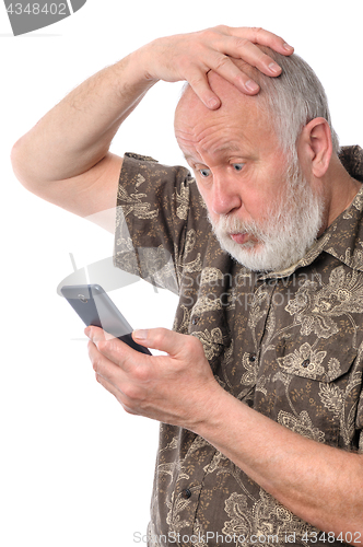 Image of senior man confused with something at mobile smartphone, isolated on white