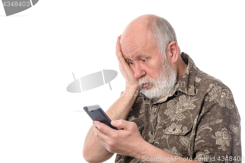 Image of senior man surprized with something at mobile smartphone, isolated on white