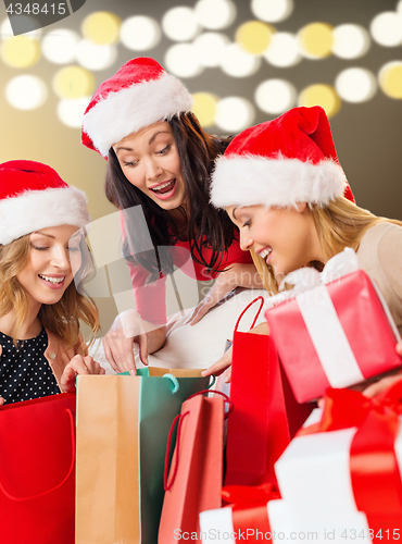 Image of women with shopping bags and christmas gifts