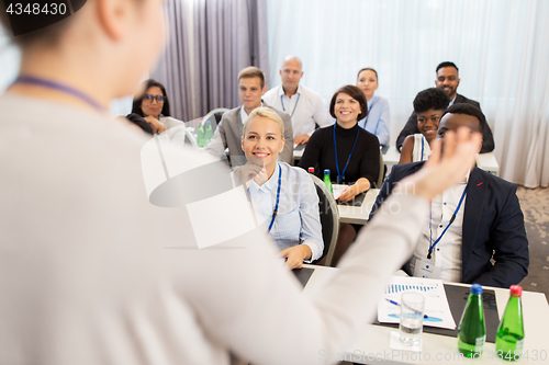 Image of group of people at business conference or lecture