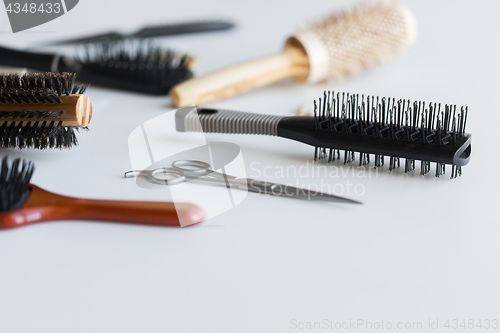 Image of scissors and different hair brushes