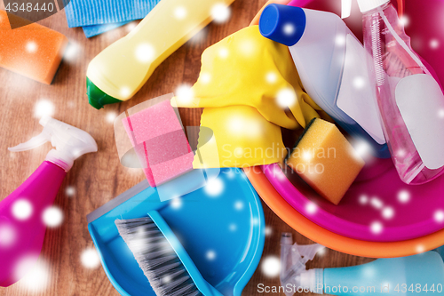 Image of basin with cleaning stuff on wooden floor