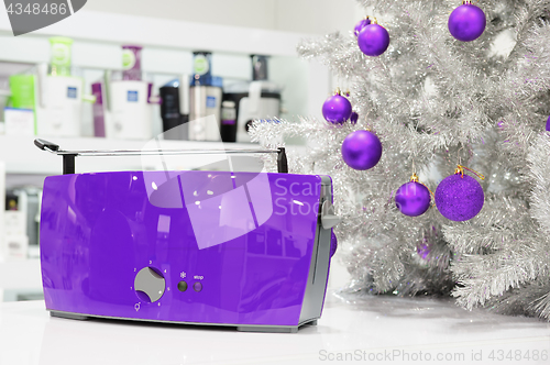 Image of Ultraviolet home appliances store at Christmas