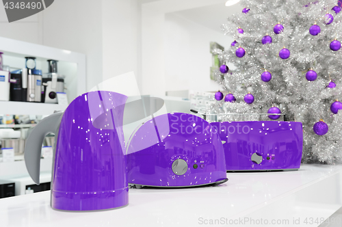 Image of Ultraviolet home appliances store at Christmas