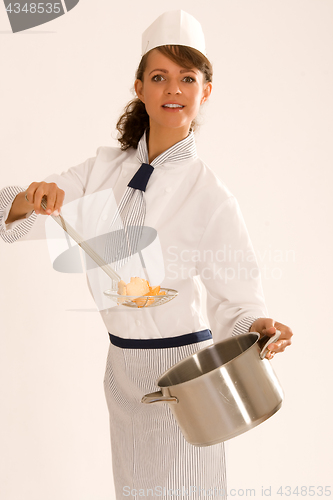 Image of female chef with cooking pot