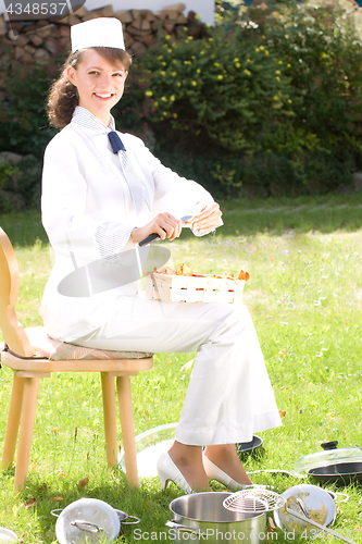 Image of female chef with chanterelle mushrooms,