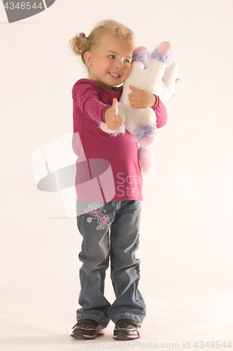 Image of Positive girl with cuddly toy