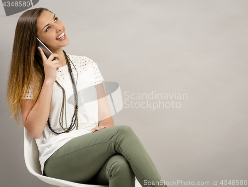 Image of Woman talking on phone