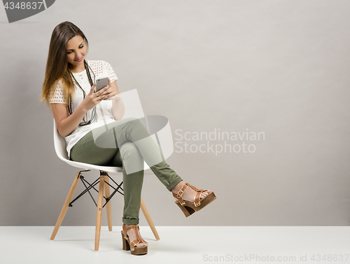 Image of Woman texting