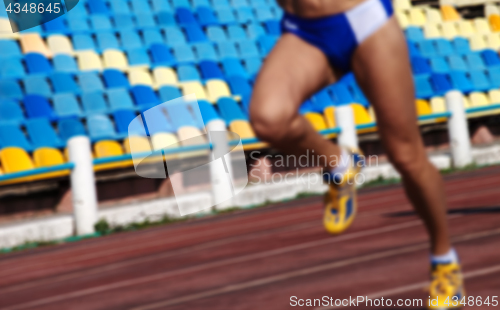 Image of Blurred athletic running competition at stadium not in focus