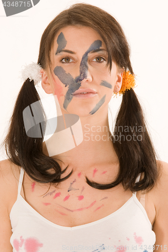 Image of Young woman with paint on his face