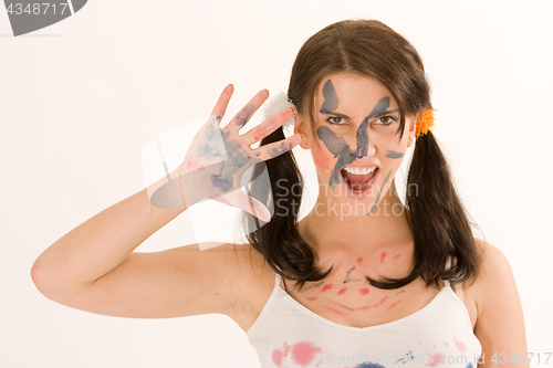 Image of Young woman with paint on his face