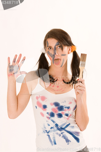 Image of Young woman with paint on his face