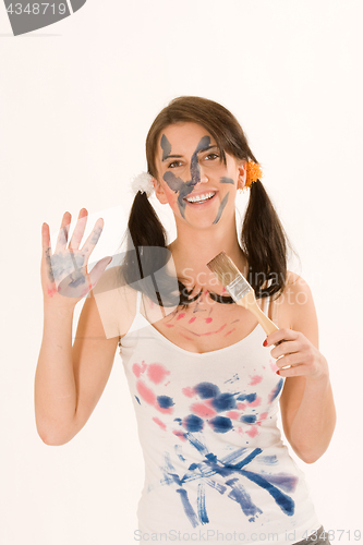 Image of Young woman with paint on his face