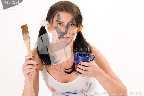 Image of young woman making coffee break