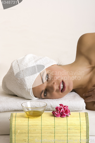 Image of Relaxed face of a young woman in spa