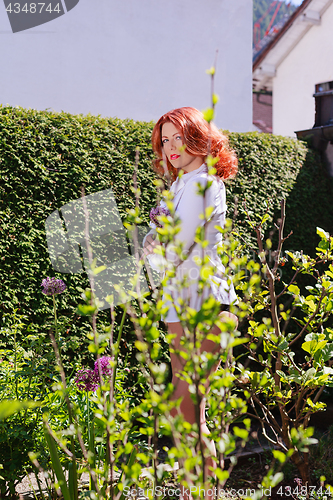 Image of Beautiful woman in the garden