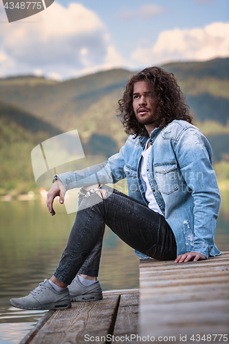 Image of He enjoys the silence at the lake