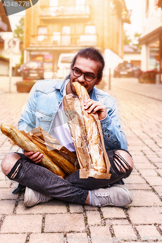 Image of Young man in the morning in the city