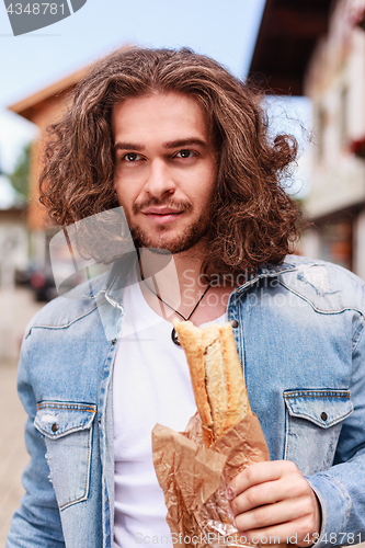 Image of Happy with a fresh baguette in the morning