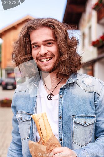 Image of Happy with a fresh baguette in the morning