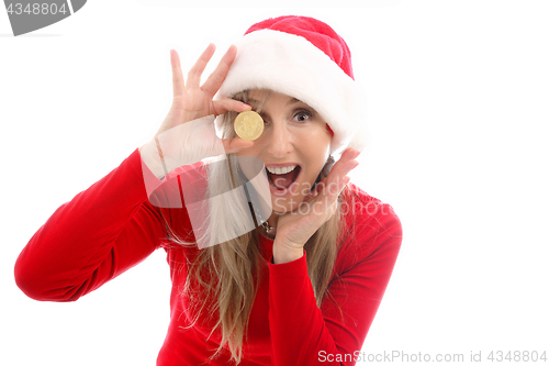 Image of Woman h olding a Bitcoin to eyeball and surprised face