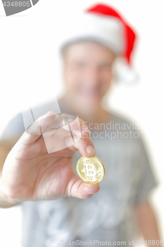 Image of Man holding a Bitcoin digital currency  cryptocurrency