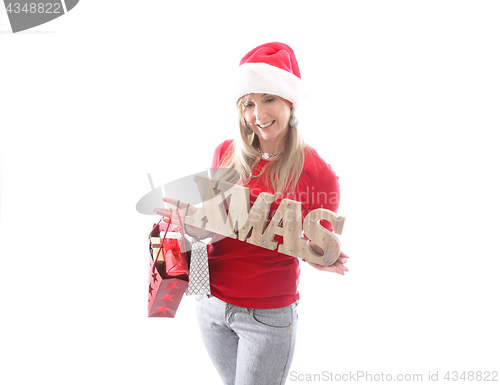 Image of Festive woman holding a Xmas sign