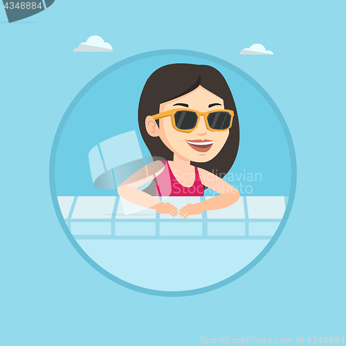 Image of Smiling young woman in swimming pool.