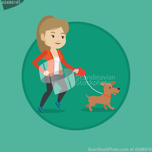 Image of Young woman walking with her dog.