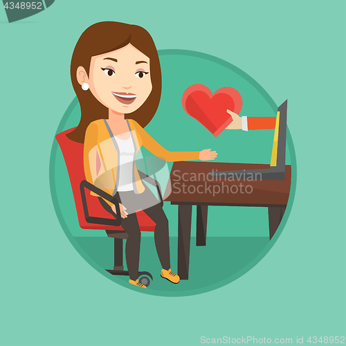 Image of Young woman dating online using laptop.