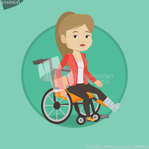 Image of Woman with broken leg sitting in wheelchair.