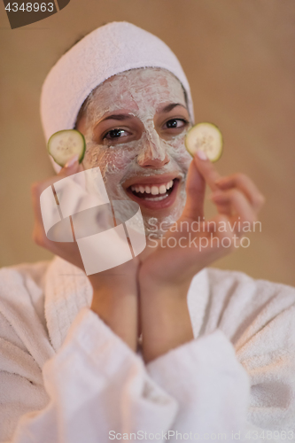 Image of Spa Woman applying Facial Mask