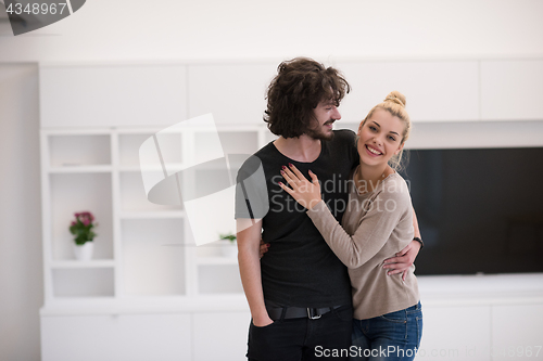 Image of couple hugging in their new home