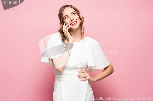 Image of Happy woman phone talking. Face with toothy smile