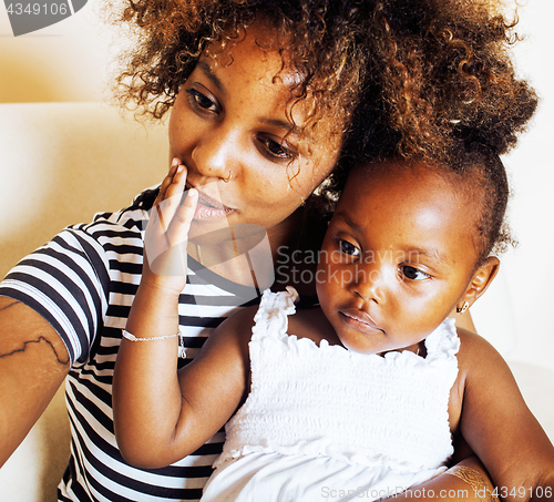 Image of adorable sweet young afro-american mother with cute little daugh