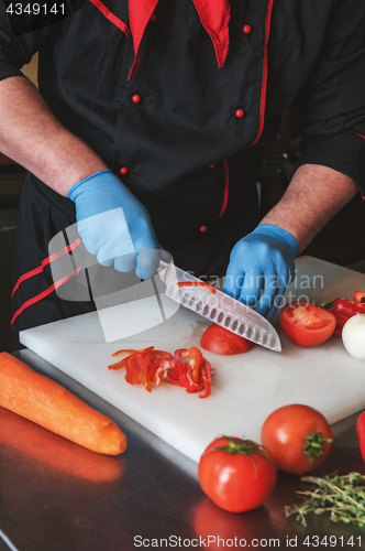 Image of Chef cutting vegetables