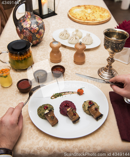 Image of Man eating in georgian restaurant