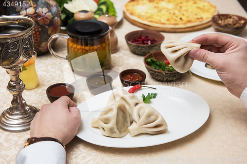 Image of Man eating in georgian restaurant