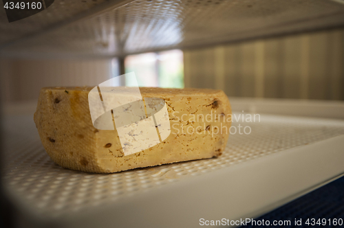 Image of aging cheese heads