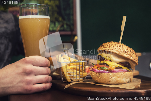 Image of Man eating burgers