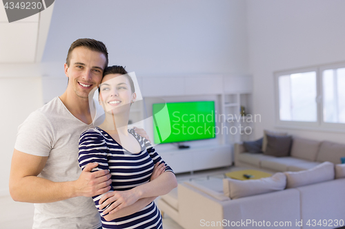 Image of couple hugging in their new home