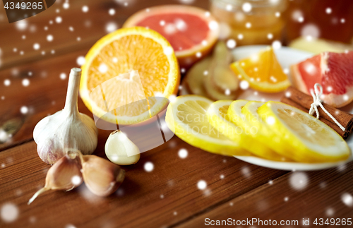 Image of garlic, lemon, orange and other folk remedy