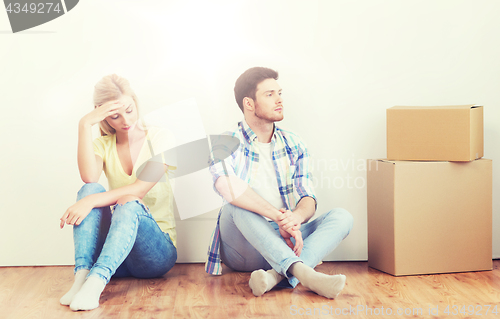 Image of unhappy couple having argument at home