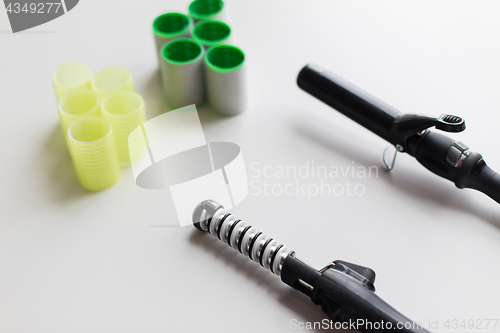 Image of curling irons or hot stylers and hair curlers